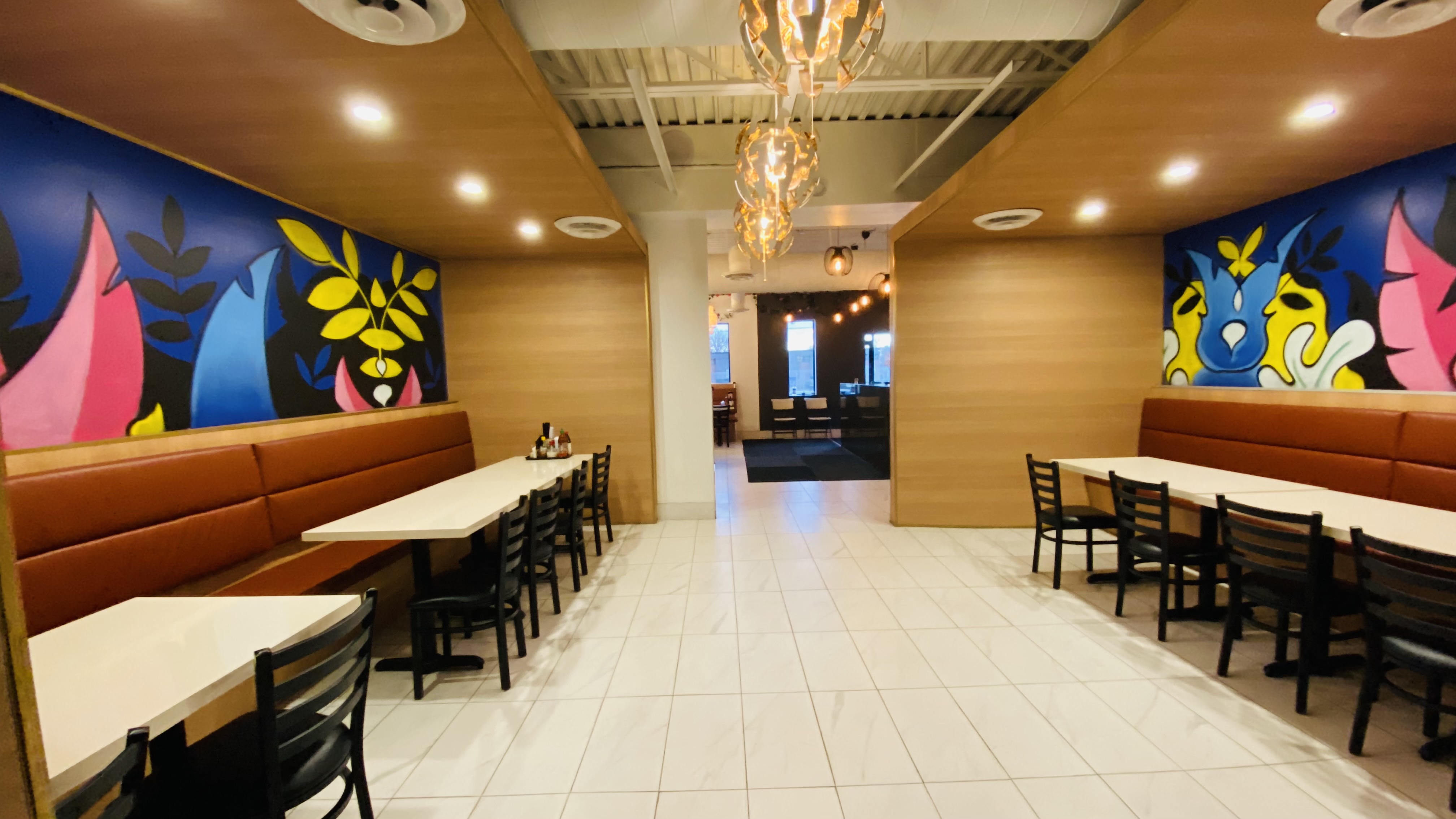 Pho Queen dining room seating and mural walls